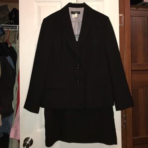 Casual all black 2 piece skirt suit.